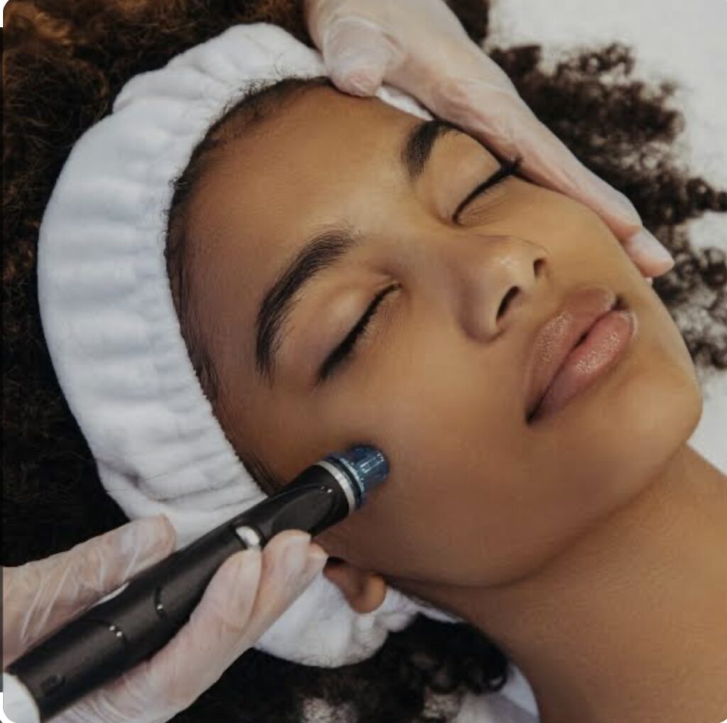 esthetician giving a young lady a facial session for glowing skin